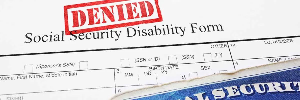 A Social Security Disability application form stamped “Denied”